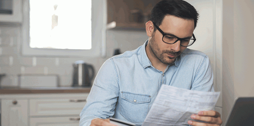 man reviewing paper